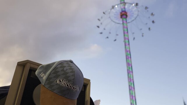 Star Flyer is worlds largest portable swing or chain carousel, standing at impressive height. Popular attraction at Oktoberfest in Munich, Bavaria, offering riders thrilling view of festival grounds. 