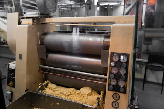 Chocolate factory conching machine, industrial production, neutral background