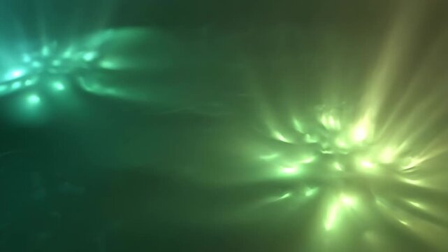 Abstract glowing lights pulse and shift through a spectrum of vibrant colors. This ethereal background evokes a sense of wonder and cosmic energy.