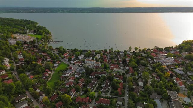 Panoramic view of Ammersee in Bavaria with floating boats, prealpine lake, serene shore, summer vacation, idyllic village, leisure, wide angle, tourism hotspot, natural beauty, peaceful waterfront. 
