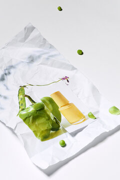 Creative composition of pepper, nail polish and peas 
