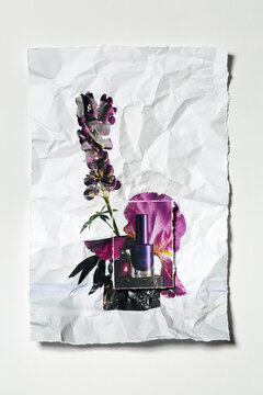 photo on crumpled paper with flowers and a bottle of nail polish