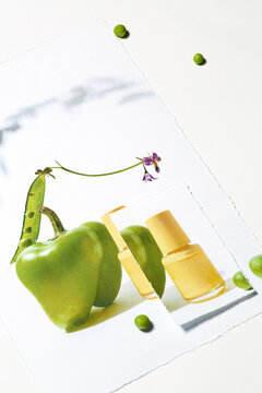 Creative composition of pepper, nail polish and peas 