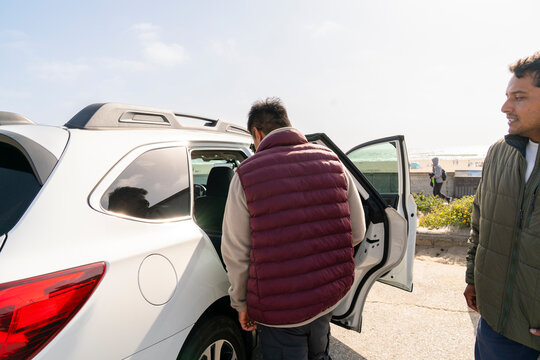 passengers entering car