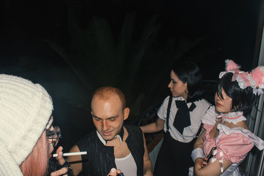 Friends enjoying a night out in costumes at a gathering