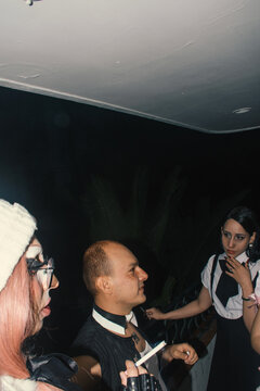 Friends engage in lively conversation at nighttime gathering