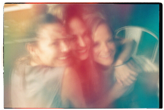 Blurred Group Hug at Night

