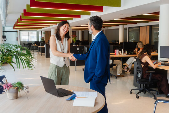 Businessman greets a customer
