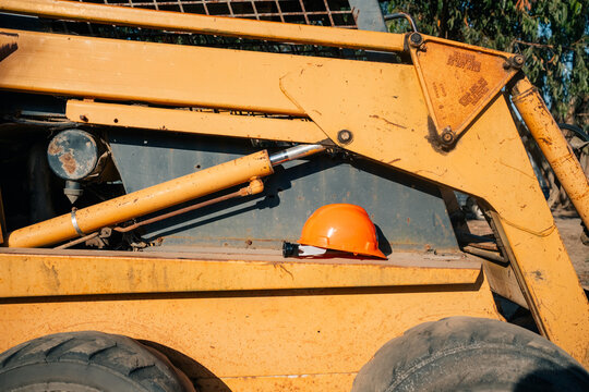 Construction Site Machinery With Safety Helmet in Daytime