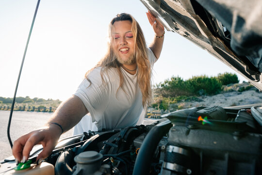 Car Repair Activity During a Sunny Day in a Coastal Area