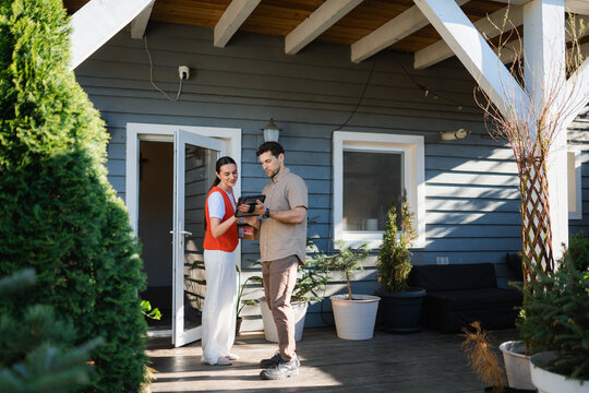 The courier delivers the parcel