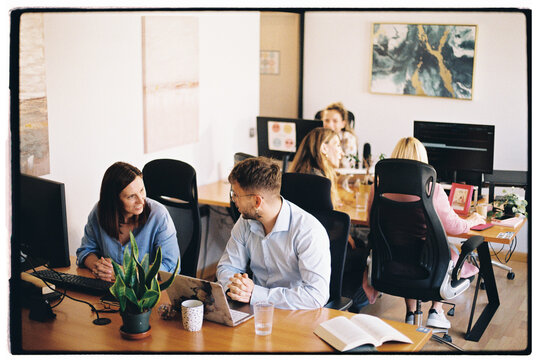 Colleagues talking at work