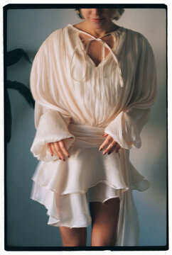 Feminine woman in beautiful lite dress