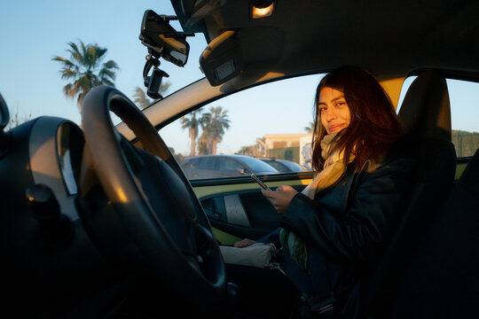 Woman Sitting in a Car
