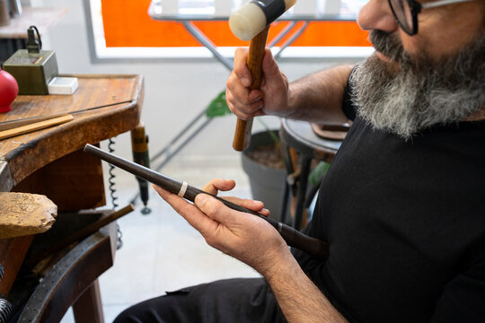 Man adjusting silver ring