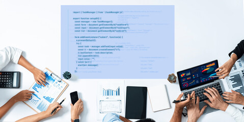 A diverse team engages in a collaborative software development project, analyzing data on screens...