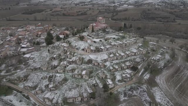 Aerial video of the snow-covered vineyards of Moradillo de Roa, Spain.