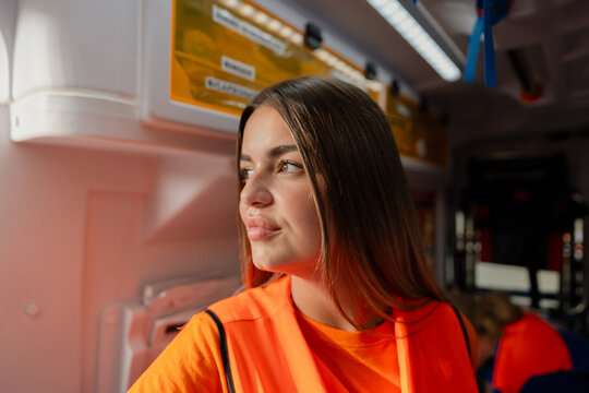 portrait of a paramedic in orange uniform