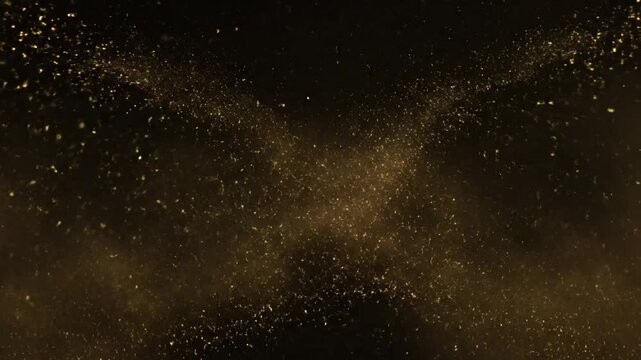 Golden luminous particles exploding on a dark background creating an energetic abstract light effect