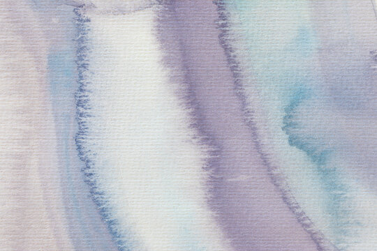 Purple blue watercolors painted on paper
