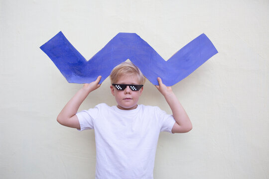 Boy with cardboard blue zigzag