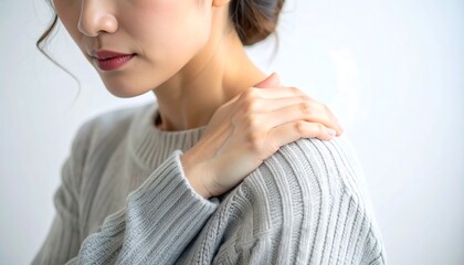 Woman touching shoulder showing pain fatigue and physical discomfort in daily life context