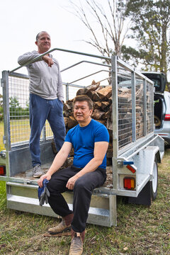 Gay couple Preparing Firewood at a Rural Location in the Afternoon