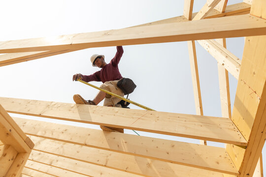 Hispanic Construction Worker Tape Measure 