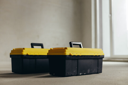 Two Closed Tool Cases With Handles And Latches Positioned Side By Side.