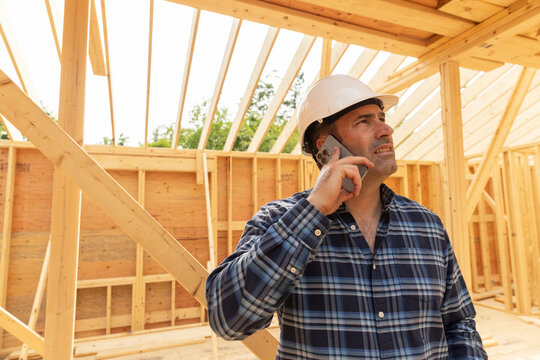 Foreman Construction Site with cell phone 