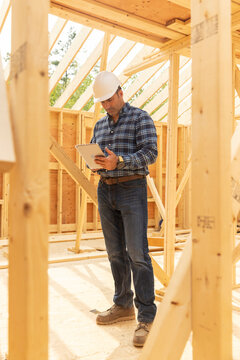 Residential Construction Foreman on table computer 
