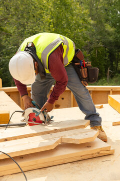 Construction Site wood Worker and saw 