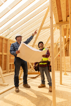 Construction manager meeting with house plans 