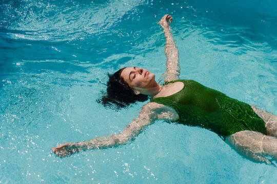 Woman enjoys her time in the pool