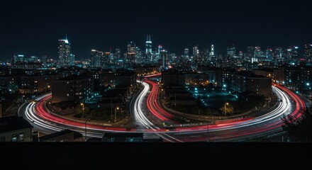 Night cityscape with illuminated roads and skyline
