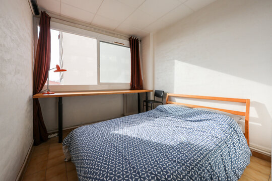 Cozy Bedroom With Large Window and Natural Light