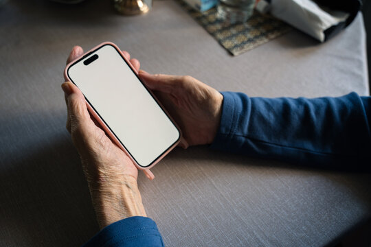 Phone in senior hands