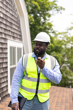 Black Construction hard hat  Worker walkie talkie
