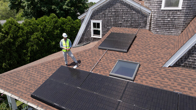 House Solar Panel Inspection worker aerial view 