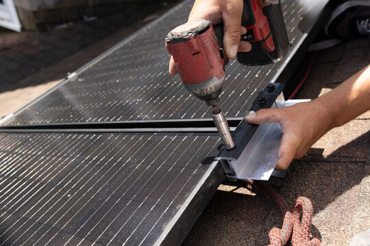 House Solar Panel  Installation with drill