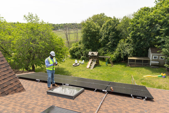 House Solar Panel contractor   black worker 