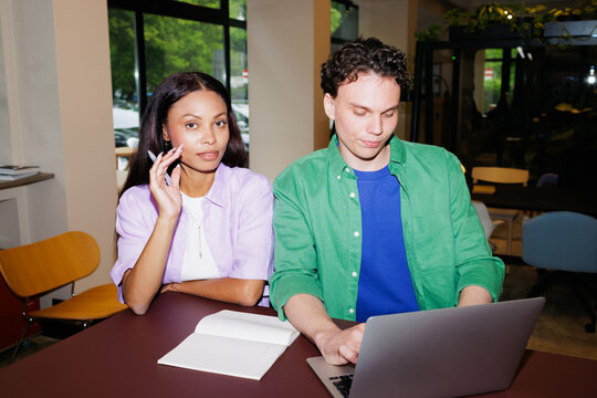 Business Partners with laptop in Studio Workspace