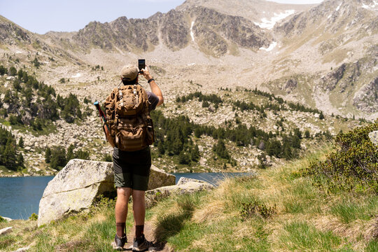 Hiker takes photo mountain