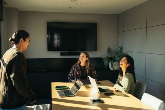 Coworker joining a meeting in the office