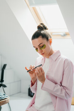 A woman gets a manicure for herself