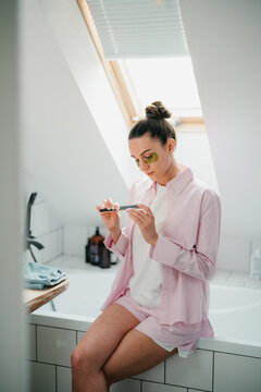 A woman gets a manicure for herself