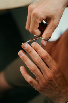 A man cuts his nails