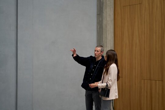 Couple Engaging in Discussion in a Modern Loft Setting