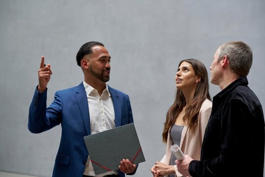 Discussion Among Colleagues in a Modern Loft Setting