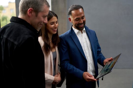 Business Team Discussing Project Details in Modern Office